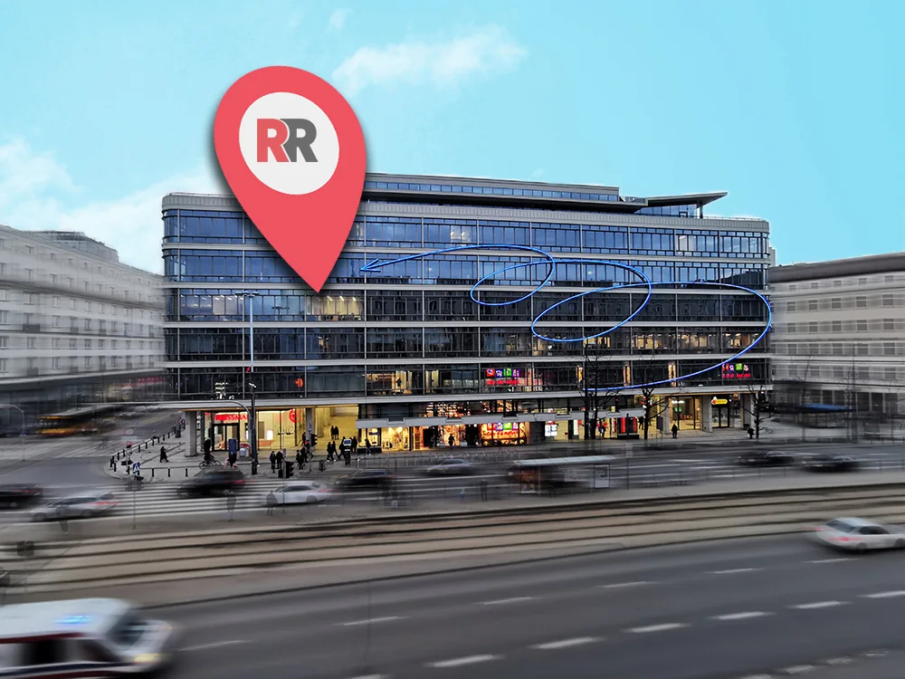 Extérieur d’un bâtiment avec un repère de localisation rouge